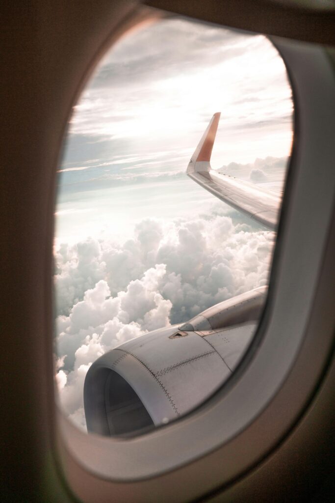 looking out the window of a commercial jet